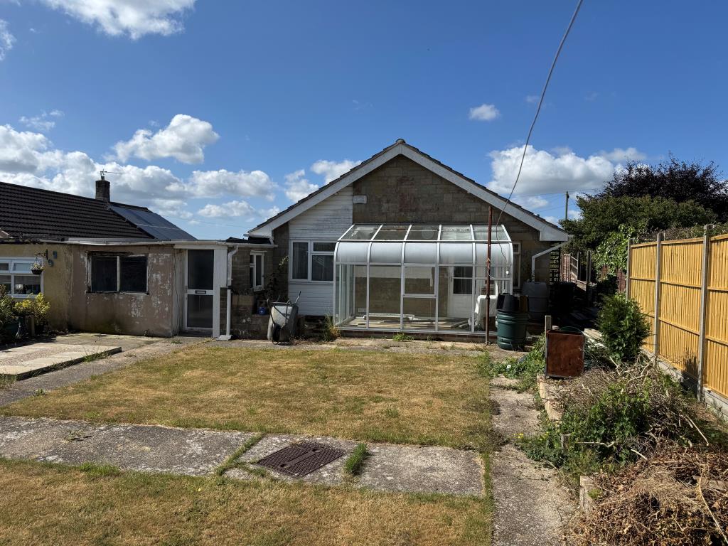 Lot: 141 - FREEHOLD THREE-BEDROOM DETACHED BUNGALOW FOR IMPROVEMENT - A View of the Rear of the Bungalow